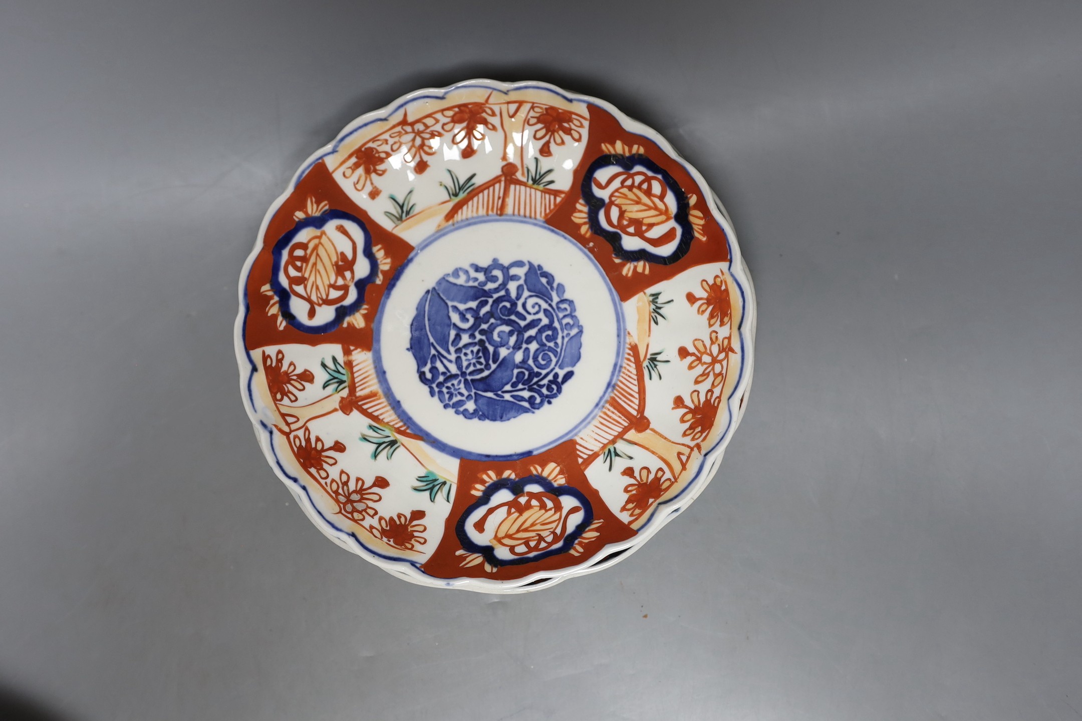 A collection of Chinese 19th and 20th century plates, together with Japanese Imari plates.